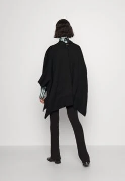 MICHAEL Michael Kors Reversible Logo Poncho - Poncho - Black 10 MICHAEL Michael Kors Reversible Logo Poncho - Poncho - Black -MICHAEL Michael Kors 37f25ffc2ae54d60b723a6b549ee01f3